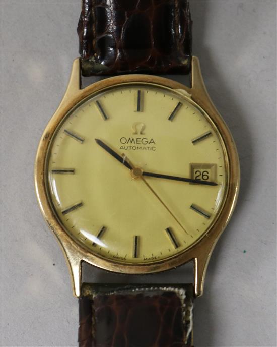 A gentlemans 9ct gold Omega automatic wrist watch (lacking winding crown).